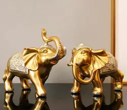 Пара слонів у золотому кольорі